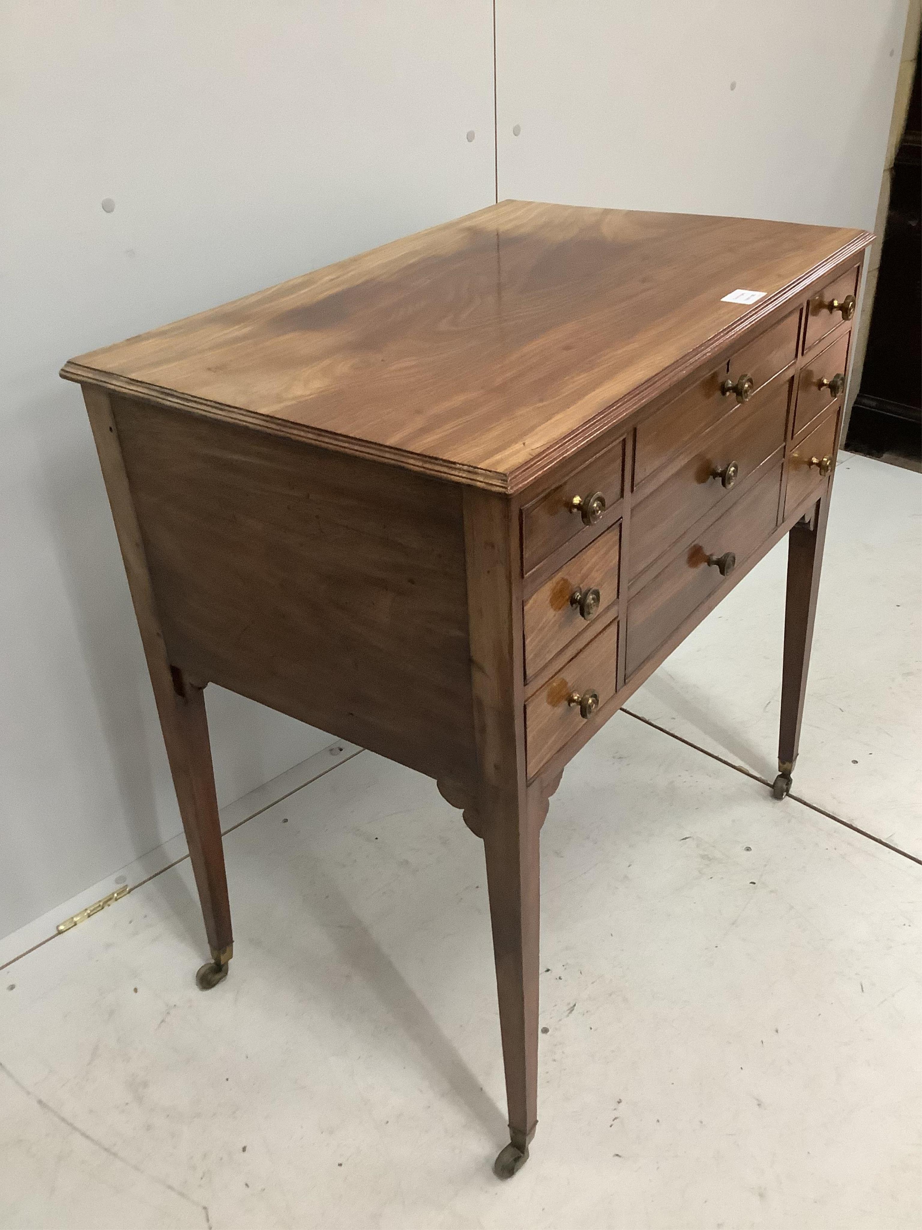 A late George III mahogany enclosed dressing table, with a lift up top, over drawers, width 78cm, depth 50cm, height 83cm. Condition - fair